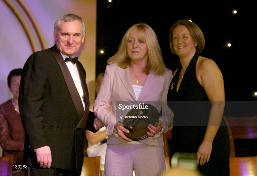 28 February 2004; Marian Carolan, on behalf of the late Kathleen Mills Hill, Dublin, who was named on the Camogie team of the Century, with An Taoiseach, Bertie Ahern, T.D,  and Miriam O'Callaghan, Uachtaran, Cumann Camogaiochta na nGael, at the Cumann Camogaiocht na nGael centenary celebrations at the Citywest Hotel, Dublin. Picture credit; Brendan Moran / SPORTSFILE *EDI*
