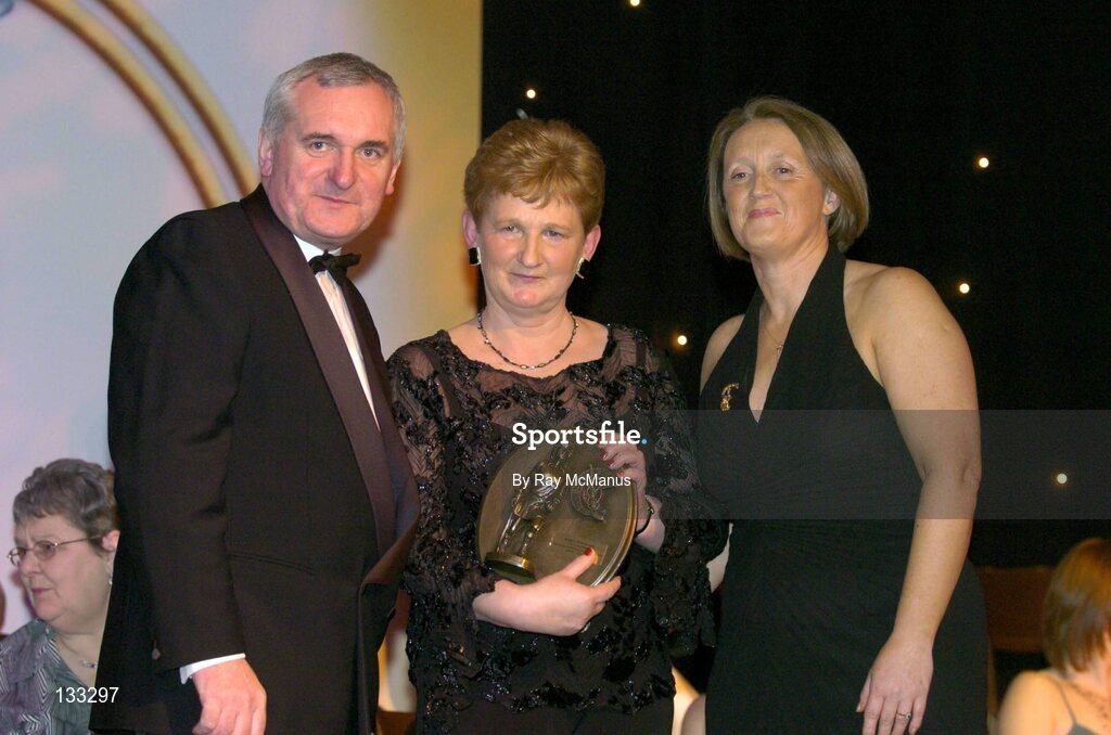 28 February 2004; Mary Fennelly, on behalf of Angela Downey Browne, Kilkenny, who was named on the Camogie team of the Century, with An Taoiseach, Bertie Ahern, TD, and Miriam O'Callaghan, Uachtaran, Cumann Camogaiochta na nGael, at the Cumann Camogaiochta na nGael centenary celebrations at the Citywest Hotel, Dublin. Picture credit; Ray McManus / SPORTSFILE *EDI*