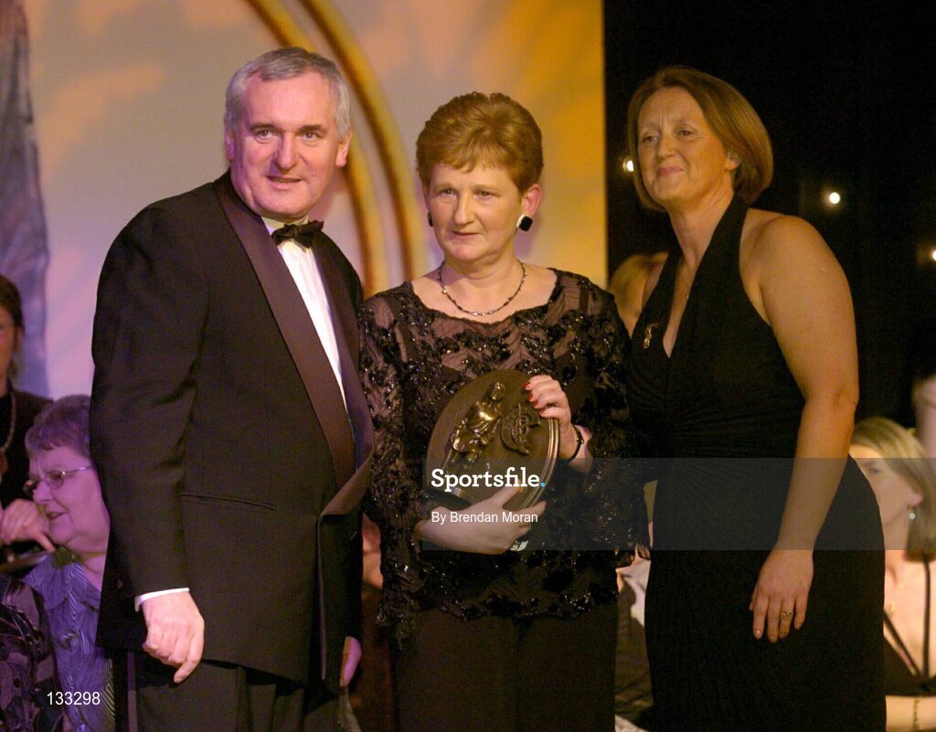 28 February 2004; Mary Fennelly, on behalf of Angela Downey Browne, Kilkenny, who was named on the Camogie team of the Century, with An Taoiseach, Bertie Ahern, T.D,  and Miriam O'Callaghan, Uachtaran, Cumann Camogaiochta na nGael, at the Cumann Camogaiocht na nGael centenary celebrations at the Citywest Hotel, Dublin. Picture credit; Brendan Moran / SPORTSFILE *EDI*