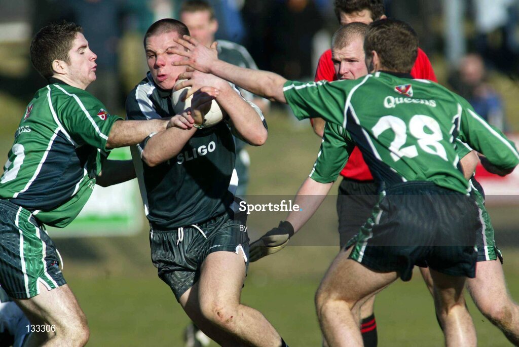 28 Ferbruary 2004; Kevin Cassidy, Sligo IT, in action against Eoin Devine and Eoin Mc Cartan, Queens. Datapac Sigerson Cup Final, Queens University Belfast v Sligo IT, Corrigan Park, Belfast, Co. Antrim. Picture credit; SPORTSFILE *EDI*