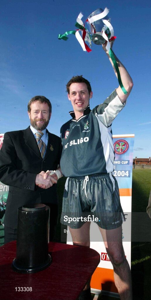 28 Ferbruary 2004; Sligo IT captain Michael Molnes is presented with the Sigerson cup by Sean Kelly, President of the GAA. Datapac Sigerson Cup Final, Queens University Belfast v Sligo IT, Corrigan Park, Belfast, Co. Antrim. Picture credit; SPORTSFILE *EDI*