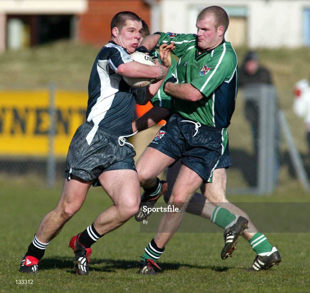 28 Ferbruary 2004; Sligo IT's Kevin Cassidy in action against Dick Clerkin, Queens. Datapac Sigerson Cup Final, Queens University Belfast v Sligo IT, Corrigan Park, Belfast, Co. Antrim. Picture credit; SPORTSFILE *EDI*
