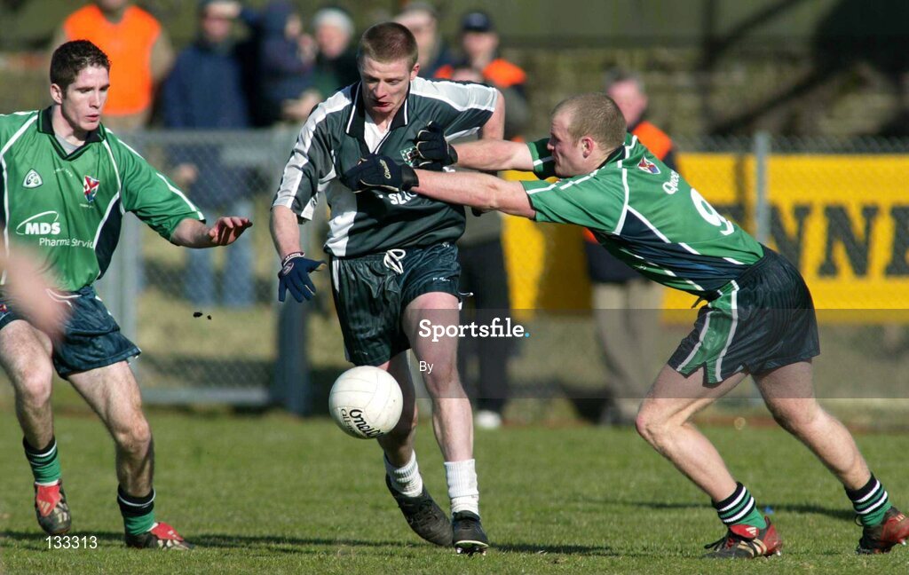 28 Ferbruary 2004; John Davey, Sligo IT, in action against Aidan Carr and Dick Clerkin, Queens. Datapac Sigerson Cup Final, Queens University Belfast v Sligo IT, Corrigan Park, Belfast, Co. Antrim. Picture credit; SPORTSFILE *EDI*