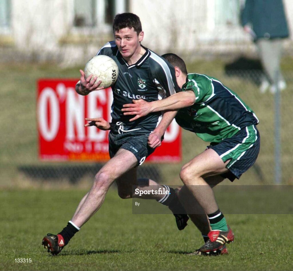 28 Ferbruary 2004; Christy Toye, Sligo IT, in action against Sean Kelly, Queens. Datapac Sigerson Cup Final, Queens University Belfast v Sligo IT, Corrigan Park, Belfast, Co. Antrim. Picture credit; SPORTSFILE *EDI*