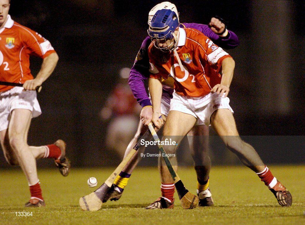28 February 2004; Tom Kenny, Cork, in action against Paul Codd, Wexford. Allianz National Hurling League, Division 1B, Cork v Wexford, Pairc Ui Rinn, Cork. Picture credit; Damien Eagers / SPORTSFILE *EDI*