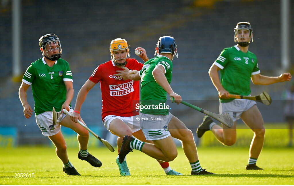 27 July 2021; Rory Sheahan of Cork in action against David Fitzgerald, left, and Mikey Fitzgibbon of Limerick during the Electric Ireland Munster GAA Minor Hurling Championship Semi-Final match between Limerick and Cork at Semple Stadium in Thurles, Tipperary. Photo by Eóin Noonan/Sportsfile