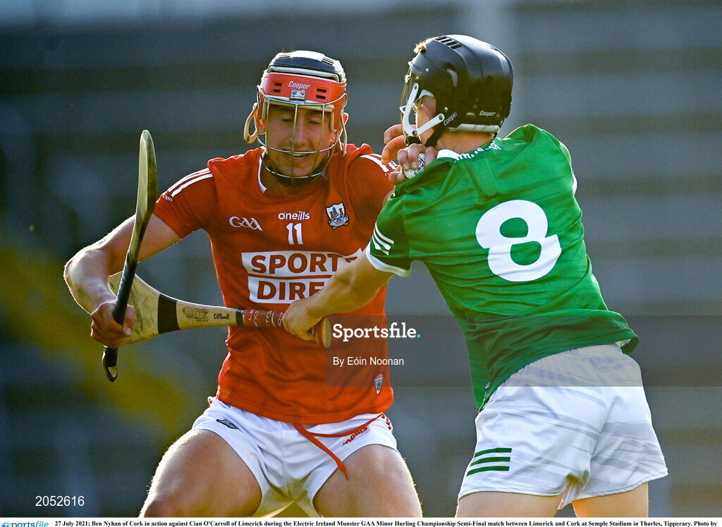 27 July 2021; Ben Nyhan of Cork in action against Cian O'Carroll of Limerick during the Electric Ireland Munster GAA Minor Hurling Championship Semi-Final match between Limerick and Cork at Semple Stadium in Thurles, Tipperary. Photo by Eóin Noonan/Sportsfile