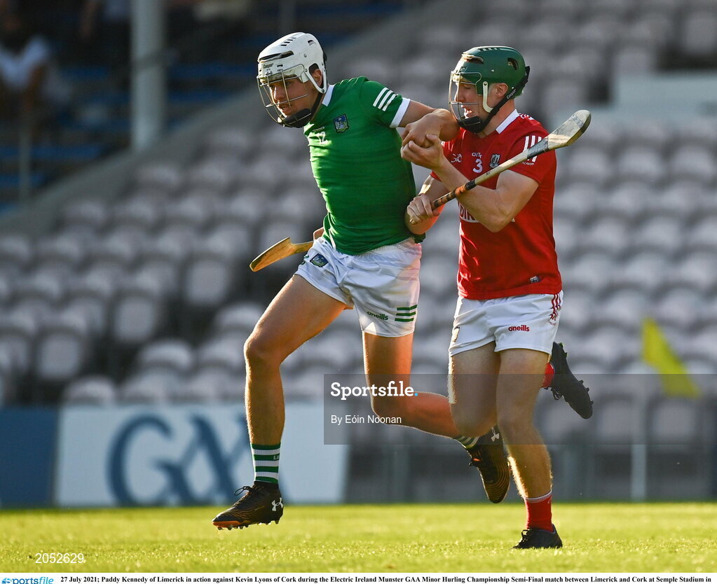 27 July 2021; Paddy Kennedy of Limerick in action against Kevin Lyons of Cork during the Electric Ireland Munster GAA Minor Hurling Championship Semi-Final match between Limerick and Cork at Semple Stadium in Thurles, Tipperary. Photo by Eóin Noonan/Sportsfile