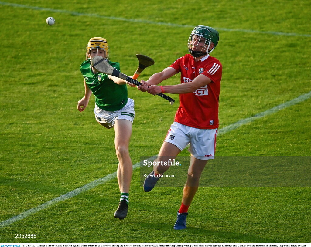 27 July 2021; James Byrne of Cork in action against Mark Riordan of Limerick during the Electric Ireland Munster GAA Minor Hurling Championship Semi-Final match between Limerick and Cork at Semple Stadium in Thurles, Tipperary. Photo by Eóin Noonan/Sportsfile