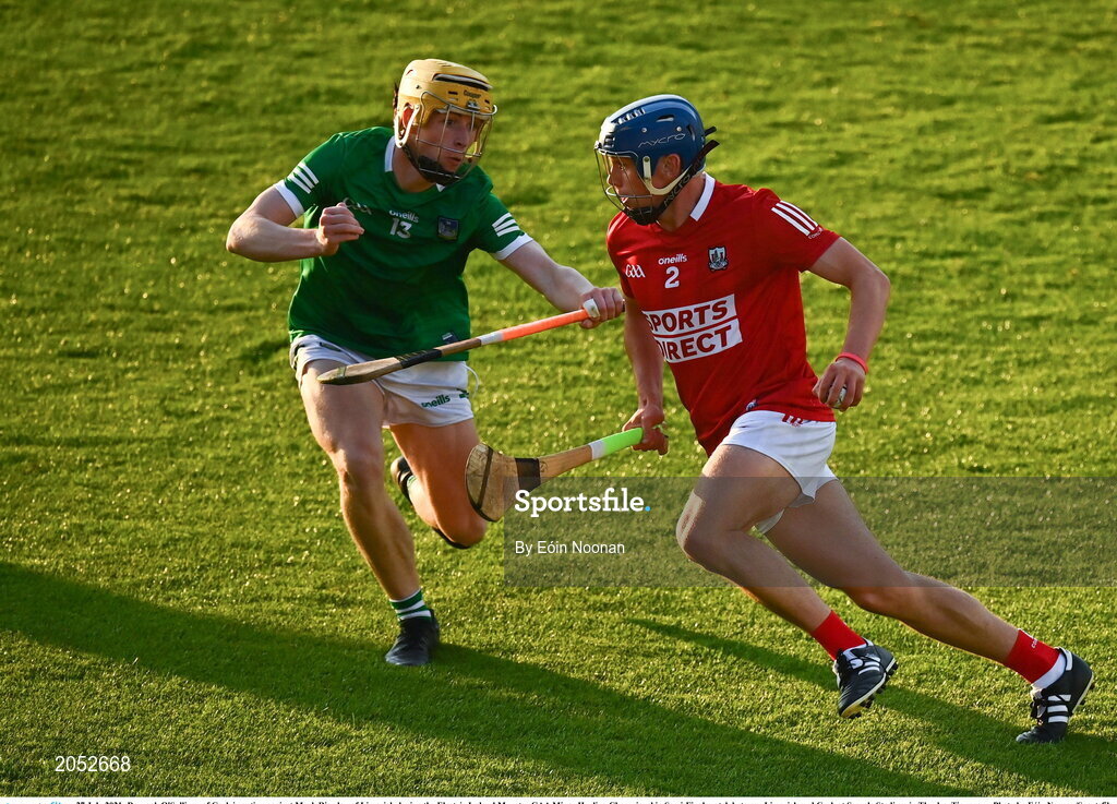 27 July 2021; Darragh O'Sullivan of Cork in action against Mark Riordan of Limerick during the Electric Ireland Munster GAA Minor Hurling Championship Semi-Final match between Limerick and Cork at Semple Stadium in Thurles, Tipperary. Photo by Eóin Noonan/Sportsfile