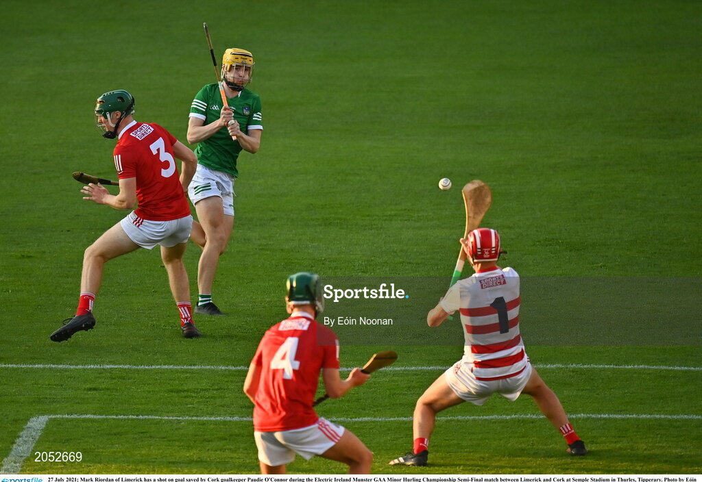 27 July 2021; Mark Riordan of Limerick has a shot on goal saved by Cork goalkeeper Paudie O'Connor during the Electric Ireland Munster GAA Minor Hurling Championship Semi-Final match between Limerick and Cork at Semple Stadium in Thurles, Tipperary. Photo by Eóin Noonan/Sportsfile