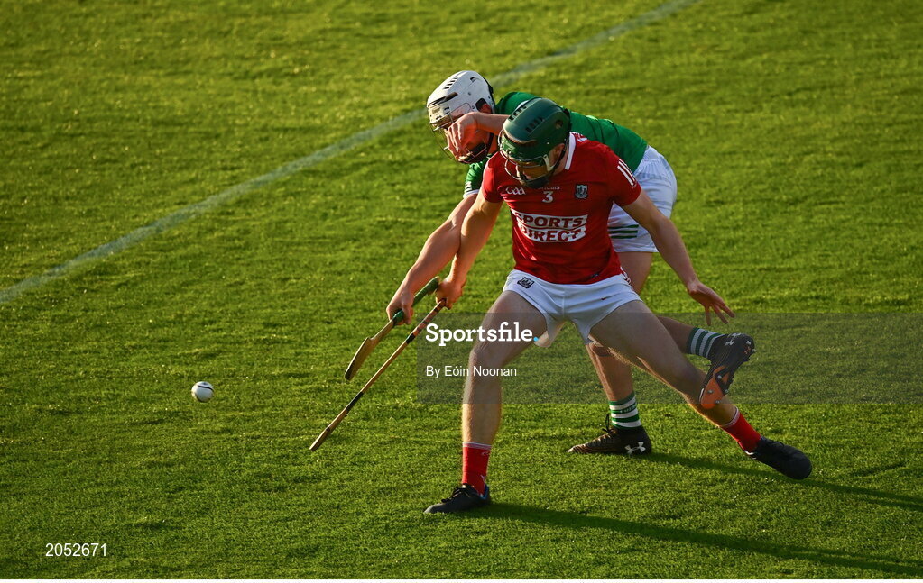 27 July 2021; Kevin Lyons of Cork in action against Paddy Kennedy of Limerick during the Electric Ireland Munster GAA Minor Hurling Championship Semi-Final match between Limerick and Cork at Semple Stadium in Thurles, Tipperary. Photo by Eóin Noonan/Sportsfile