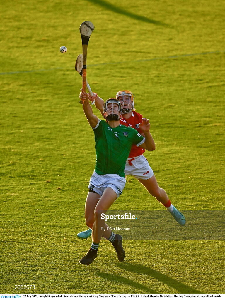 27 July 2021; Joseph Fitzgerald of Limerick in action against Rory Sheahan of Cork during the Electric Ireland Munster GAA Minor Hurling Championship Semi-Final match between Limerick and Cork at Semple Stadium in Thurles, Tipperary. Photo by Eóin Noonan/Sportsfile
