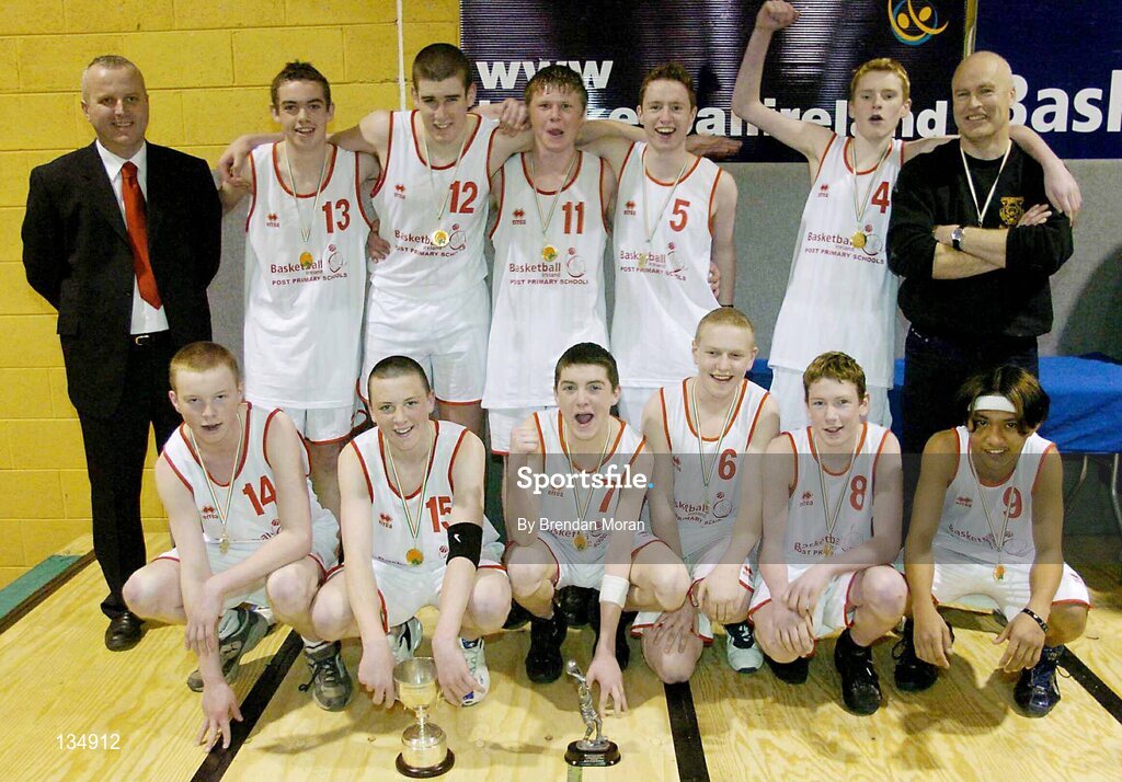 23 March 2004; The St Pat's team, Shannon, celebrate with the cup after the game. All-Ireland Schoolboys Basketball League, U16 'C'  Final, Dunshaughlin Community College, Meath v St Pat's, Shannon, Co. Clare, ESB Arena, Tallaght, Dublin. Picture credit; Brendan Moran / SPORTSFILE *EDI*