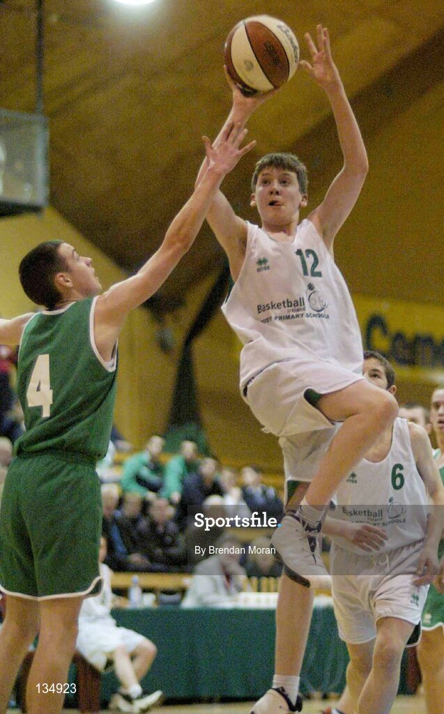 23 March 2004; Michael Higgins, St Nathy's, in action against Stuart Hehir, Ard Scoil Ris. All-Ireland Schoolboys Basketball League, U16 'B'  Final, St Nathy's, Ballaghdireen,  Co. Roscommon v Ard Scoil Ris, Limerick, ESB Arena, Tallaght, Dublin. Picture credit; Brendan Moran / SPORTSFILE *EDI*