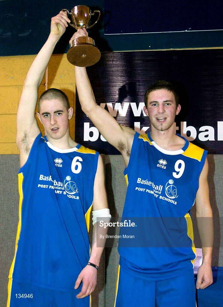 23 March 2004; The St Patrick's Comprehensive captain Gavin Smith (9) and team-mate Barry Leamy lift the cup after the game. All-Ireland Schoolboys Basketball League, U19 'C'  Final, St Aidan's, Cootehill, Co. Cavan v St Patrick's Comprehensive, Shannon, Co. Clare, ESB Arena, Tallaght, Dublin. Picture credit; Brendan Moran / SPORTSFILE *EDI*