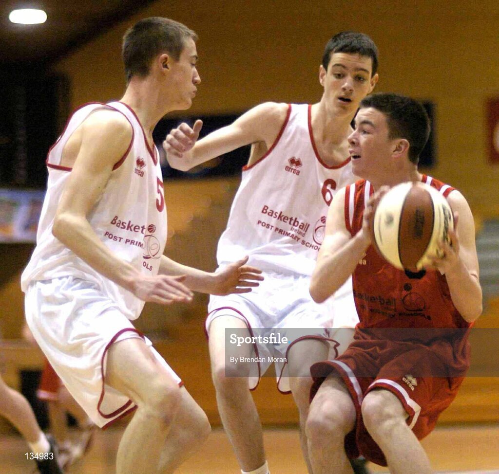 24 March 2004; Michael Chubb, St Fintan's, in action against Liam Doheny, left, and Paul O'Brien, St Joseph's. All-Ireland Schoolboys Basketball League, U16 'A'  Final, St Joseph's Patrician College, Galway v St Fintan's, Sutton, Dublin, ESB Arena, Tallaght, Dublin. Picture credit; Brendan Moran / SPORTSFILE *EDI*