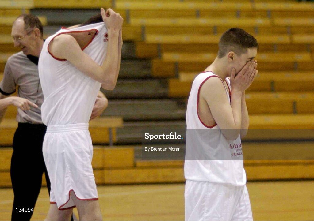 24 March 2004; St Joseph's players Paul O'Brien, left, and Stephen Kenny show their disappointment after the final whistle. All-Ireland Schoolboys Basketball League, U16 'A'  Final, St Joseph's Patrician College, Galway v St Fintan's, Sutton, Dublin, ESB Arena, Tallaght, Dublin. Picture credit; Brendan Moran / SPORTSFILE *EDI*