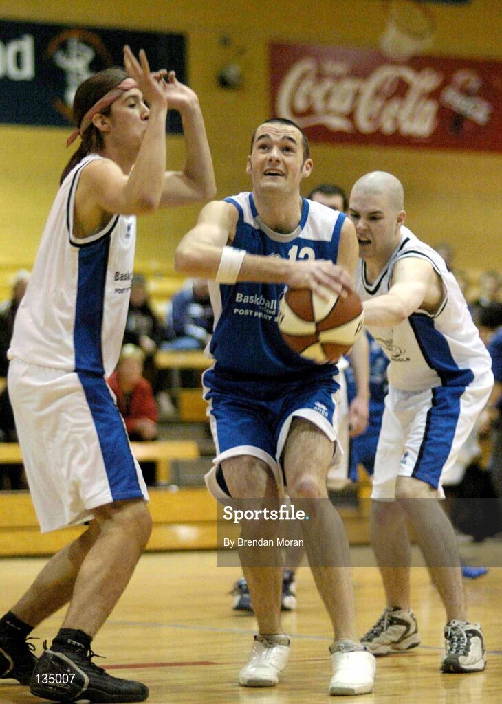 24 March 2004; John Dowling, Mercy Mounthawk, in action against Juan Pablo Flores, left, and Mark Moore, Malahide. All-Ireland Schoolboys Basketball League, U19 'B'  Final, Malahide Community School, Dublin v Mercy Mounthawk, Tralee, Co. Kerry, ESB Arena, Tallaght, Dublin. Picture credit; Brendan Moran / SPORTSFILE *EDI*