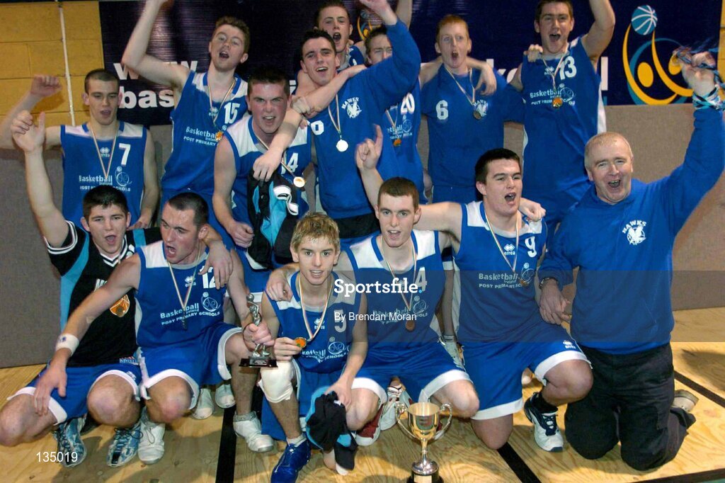 24 March 2004; The team from Mercy Mounthawk celebrate with the cup after the game. All-Ireland Schoolboys Basketball League, U19 'B'  Final, Malahide Community School, Dublin v Mercy Mounthawk, Tralee, Co. Kerry, ESB Arena, Tallaght, Dublin. Picture credit; Brendan Moran / SPORTSFILE *EDI*