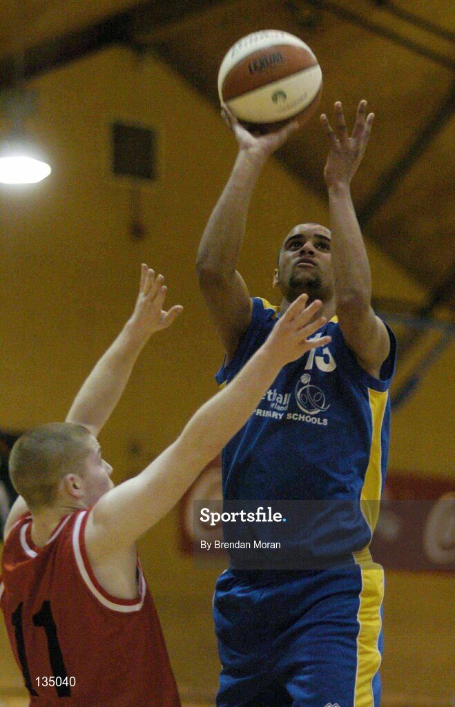 24 March 2004; Carleton Cuff, North Mon, in action against Colin Bernard, St Fintan's. All-Ireland Schoolboys Basketball League, U19 'A'  Final, St FIntan's, Sutton, Dublin v North Monastery, Cork, ESB Arena, Tallaght, Dublin. Picture credit; Brendan Moran / SPORTSFILE *EDI*