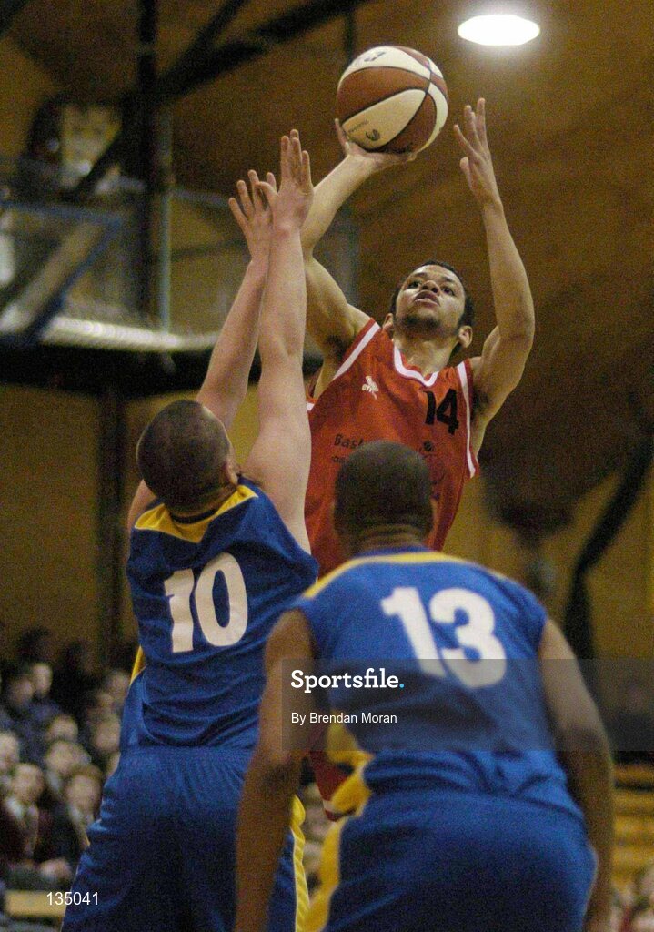 24 March 2004; Isaac Westbrooks, St Fintan's, in action against Daniel O'Mahony (10) and Carleton Cuff, North Mon. All-Ireland Schoolboys Basketball League, U19 'A'  Final, St FIntan's, Sutton, Dublin v North Monastery, Cork, ESB Arena, Tallaght, Dublin. Picture credit; Brendan Moran / SPORTSFILE *EDI*