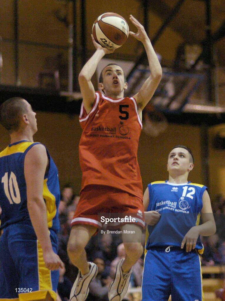 24 March 2004; Peter Grimes, St Fintan's, in action against Daniel O'Mahony (10) and Cathal O'Flaherty, North Mon. All-Ireland Schoolboys Basketball League, U19 'A'  Final, St FIntan's, Sutton, Dublin v North Monastery, Cork, ESB Arena, Tallaght, Dublin. Picture credit; Brendan Moran / SPORTSFILE *EDI*