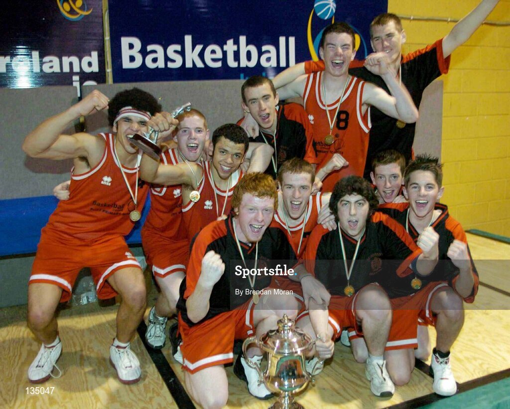24 March 2004; The team from St Fintan's, Sutton, celebrate with the cup after the game. All-Ireland Schoolboys Basketball League, U19 'A'  Final, St FIntan's, Sutton, Dublin v North Monastery, Cork, ESB Arena, Tallaght, Dublin. Picture credit; Brendan Moran / SPORTSFILE *EDI*
