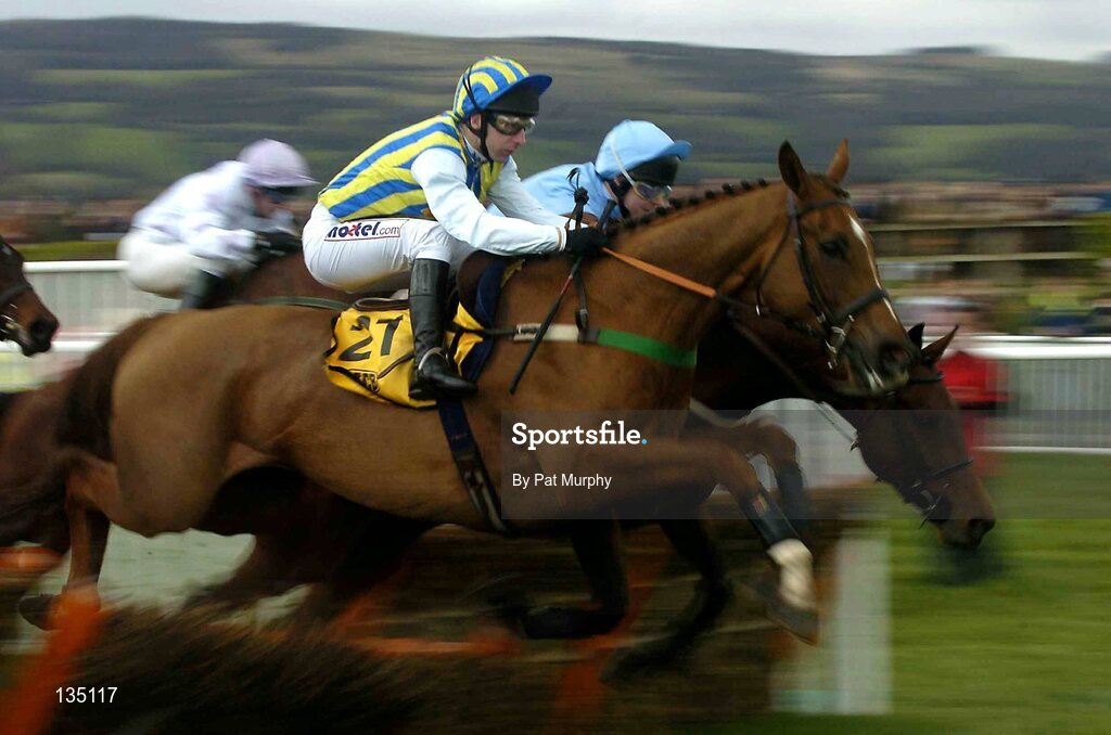 18 March 2004; Tusk, with Jim Culloty up, jumps the last first time around during the JCB Triumph Hurdle Race, Cheltenham Festival, Prestbury Park, Cheltenham, England. Horse Racing. Picture credit; Pat Murphy / SPORTSFILE *EDI*
