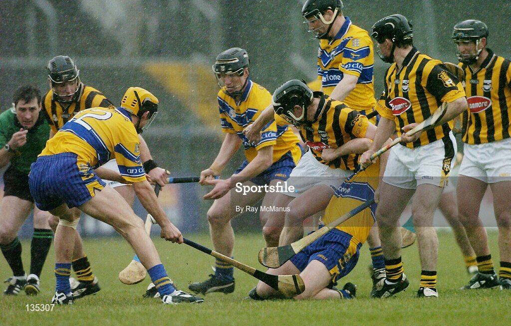 21 March 2004; Referee Seamus Roche watches the action featuring JJ Delaney, (K), Tony Griffin, 12, (C), Niall Gilligan, (C), Peter Barry, (K), Frank Lohan, (C),  Colin Lynch, (C), Noel Hickey and Paddy Mulally, Kilkenny.Allianz Hurling League 2004, Division 1A, Round 4, Clare v Kilkenny, Cusack Park, Ennis, Co. Clare. Picture credit; Ray McManus / SPORTSFILE *EDI*