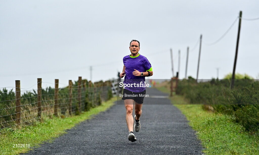 23 October 2021; Parkrun Ireland in partnership with Vhi, added a new parkrun at Achill Greenway on Saturday, 23rd of October, with the introduction of the Achill Greenway parkrun at Achill Greenway, Great Western Greenway in Achill, Mayo. Parkruns take place over a 5km course weekly, are free to enter and are open to all ages and abilities, providing a fun and safe environment to enjoy exercise. To register for a parkrun near you visit www.parkrun.ie. Pictured during the parkrun is winner Ashley Hayes, from Poolbeg in Dublin, running his 100th parkrun. Photo by Brendan Moran/Sportsfile
