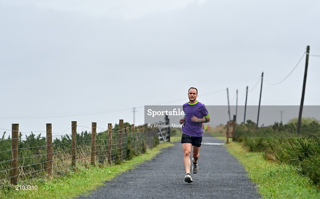 23 October 2021; Parkrun Ireland in partnership with Vhi, added a new parkrun at Achill Greenway on Saturday, 23rd of October, with the introduction of the Achill Greenway parkrun at Achill Greenway, Great Western Greenway in Achill, Mayo. Parkruns take place over a 5km course weekly, are free to enter and are open to all ages and abilities, providing a fun and safe environment to enjoy exercise. To register for a parkrun near you visit www.parkrun.ie. Pictured during the parkrun is winner Ashley Hayes, from Poolbeg in Dublin, running his 100th parkrun. Photo by Brendan Moran/Sportsfile