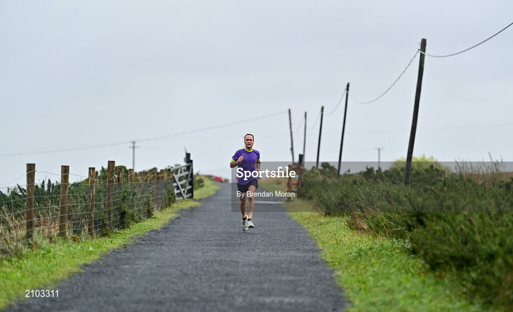 23 October 2021; Parkrun Ireland in partnership with Vhi, added a new parkrun at Achill Greenway on Saturday, 23rd of October, with the introduction of the Achill Greenway parkrun at Achill Greenway, Great Western Greenway in Achill, Mayo. Parkruns take place over a 5km course weekly, are free to enter and are open to all ages and abilities, providing a fun and safe environment to enjoy exercise. To register for a parkrun near you visit www.parkrun.ie. Pictured during the parkrun is winner Ashley Hayes, from Poolbeg in Dublin, running his 100th parkrun. Photo by Brendan Moran/Sportsfile