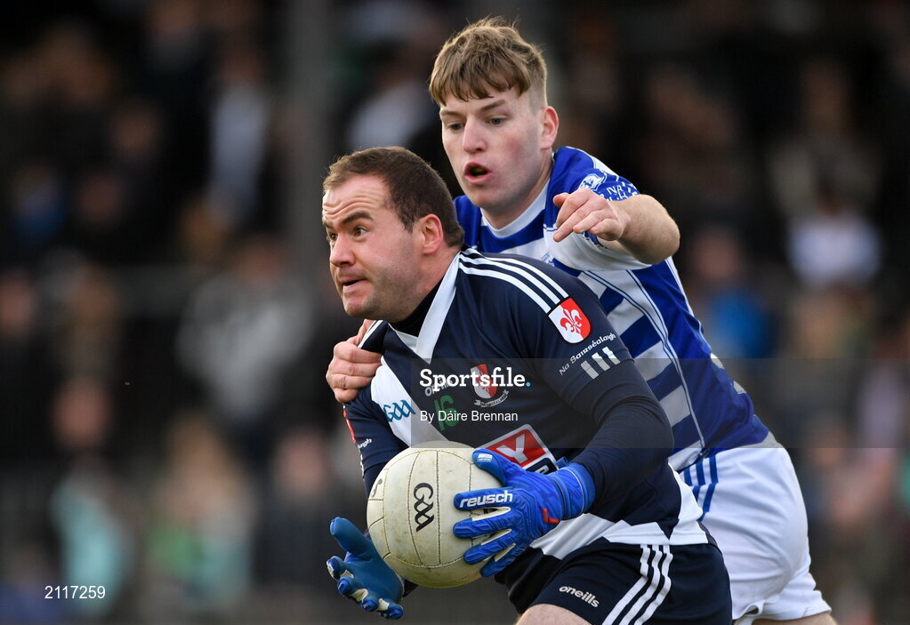 7 November 2021; John Melia of Sarsfields in action against Dermot Hanifin of Naas during the Kildare County Senior Club Football Championship Final match between Naas and Sarsfields at St Conleth's Park in Newbridge, Kildare. Photo by Daire Brennan/Sportsfile