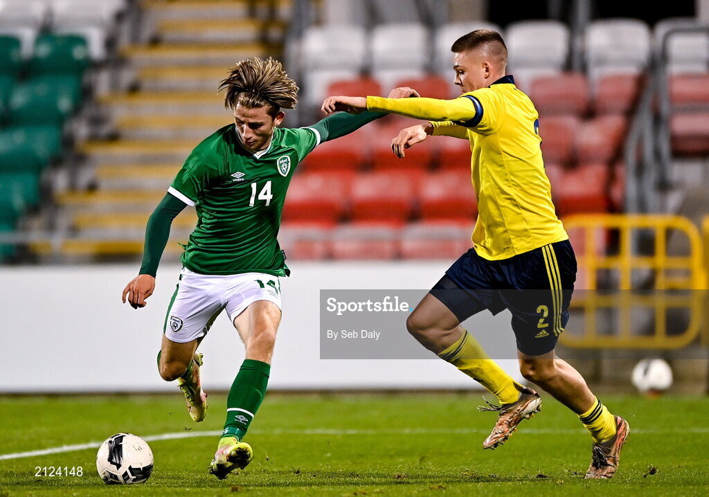 16 November 2021; Oliver O'Neill of Republic of Ireland shoots to score his side's winning goal, under pressure from Emil Holm of Sweden,  during the UEFA European U21 Championship qualifying group A match between Republic of Ireland and Sweden at Tallaght Stadium in Dublin. Photo by Seb Daly/Sportsfile