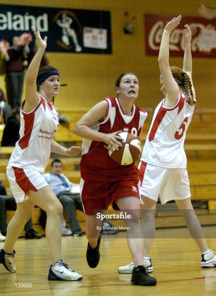 30 March 2004; Mary Walsh, Killarney, in action against Sorcha Holmes, left, and Christina Casey, Salesians. All - Ireland Schoolgirls Basketball League, Senior 'C' Final, Salesians, Limerick, v Killarney Community College, Kerry, ESB Arena, Tallaght, Dublin. Picture credit; Brendan Moran / SPORTSFILE *EDI*