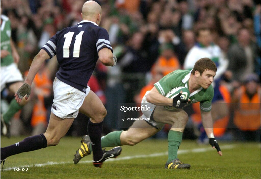 27 March 2004; Gordon D'Arcy, Ireland, scores his second try of the game despite the attentions of Simon Webster, Scotland. RBS Six Nations Rugby Championship 2003-2004, Ireland v Scotland, Lansdowne Road, Dublin. Picture credit; Brendan Moran / SPORTSFILE *EDI*