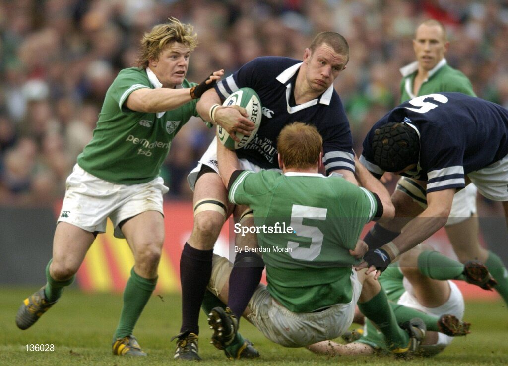 27 March 2004; Jason White, Scotland, is tackled by Brian O'Driscoll, left, and Paul O'Connell, Ireland. RBS Six Nations Rugby Championship 2003-2004, Ireland v Scotland, Lansdowne Road, Dublin. Picture credit; Brendan Moran / SPORTSFILE *EDI*