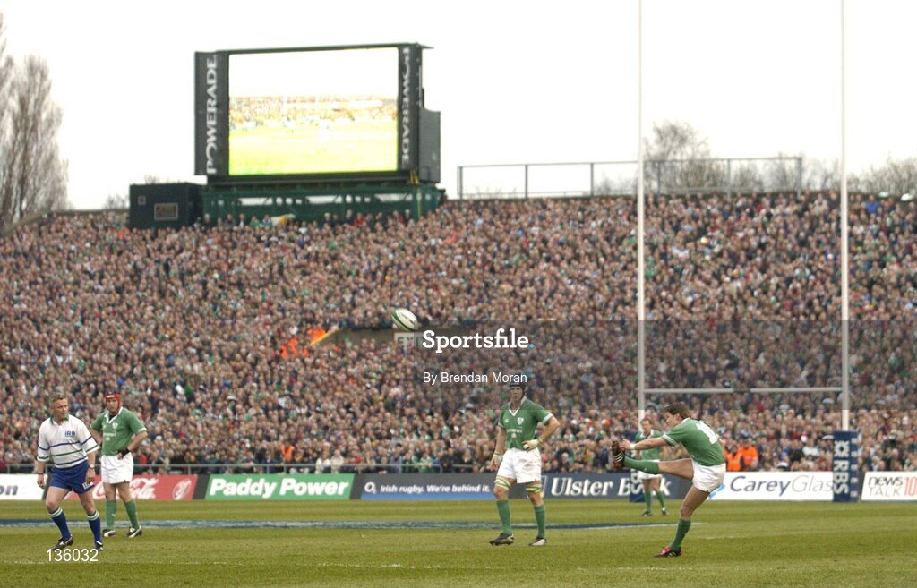 27 March 2004; Ronan O'Gara, Ireland, kicks a penalty against Scotland watched by fans in the South Terrace. RBS Six Nations Rugby Championship 2003-2004, Ireland v Scotland, Lansdowne Road, Dublin. Picture credit; Brendan Moran / SPORTSFILE *EDI*