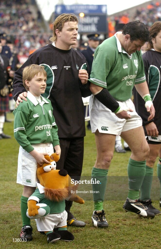 27 March 2004; Mascot Nicholas O'Grady alongside Ireland captain Brian O'Driscoll and prop Reggie Corrigan before the game against Scotland. RBS Six Nations Rugby Championship 2003-2004, Ireland v Scotland, Lansdowne Road, Dublin. Picture credit; Brendan Moran / SPORTSFILE *EDI*
