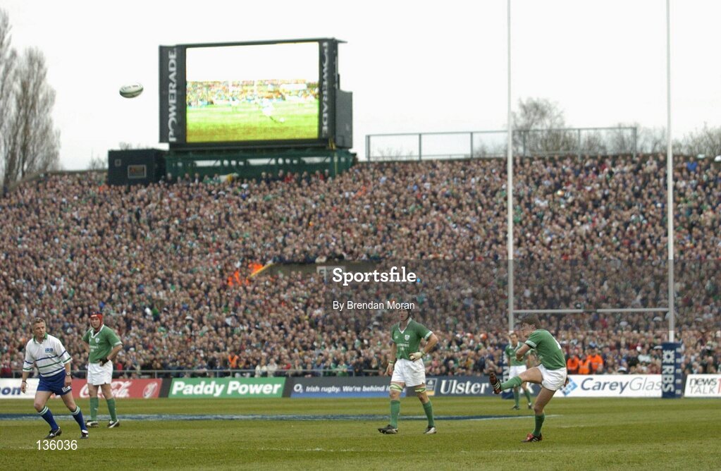 27 March 2004; Ronan O'Gara, Ireland, kicks a penalty against Scotland watched by fans in the South Terrace. RBS Six Nations Rugby Championship 2003-2004, Ireland v Scotland, Lansdowne Road, Dublin. Picture credit; Brendan Moran / SPORTSFILE *EDI*