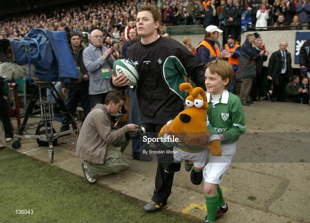 27 March 2004; Ireland captain Brian O'Driscoll and mascot Nicholas O'Grady lead the Irish team out before the game against Scotland. RBS Six Nations Rugby Championship 2003-2004, Ireland v Scotland, Lansdowne Road, Dublin. Picture credit; Brendan Moran / SPORTSFILE *EDI*
