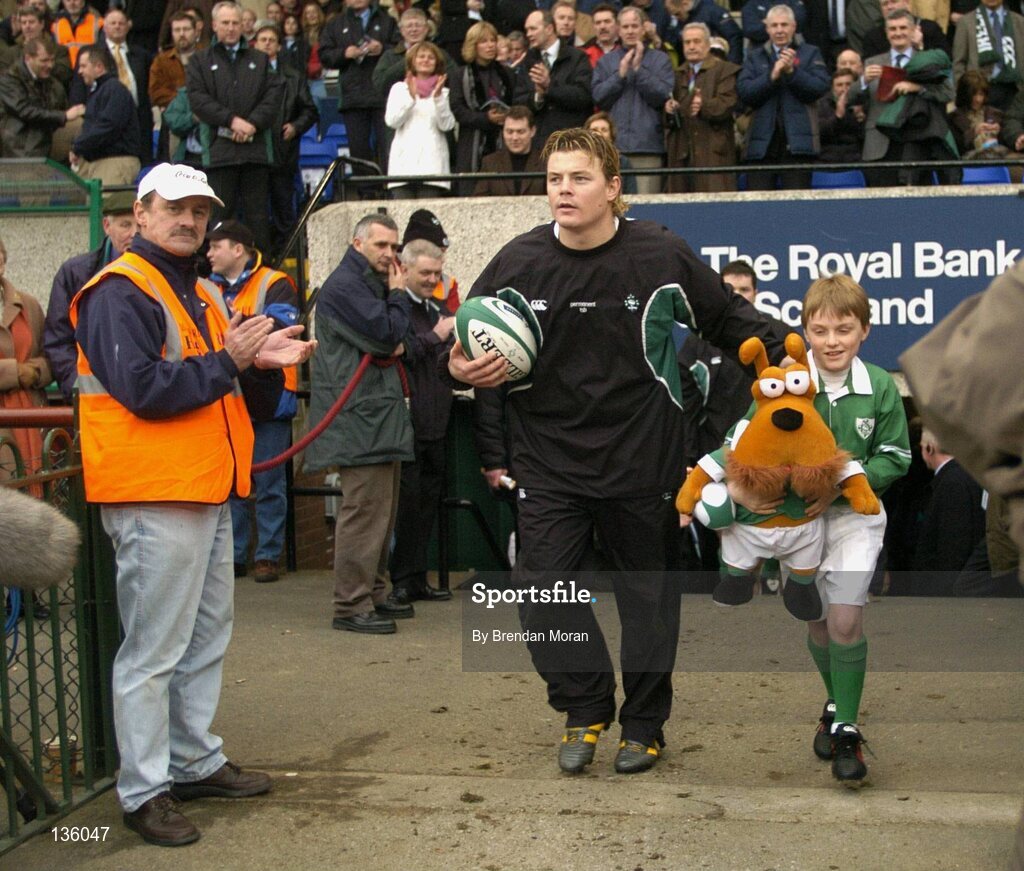 27 March 2004; Ireland captain Brian O'Driscoll and mascot Nicholas O'Grady lead the Irish team out before the game against Scotland. RBS Six Nations Rugby Championship 2003-2004, Ireland v Scotland, Lansdowne Road, Dublin. Picture credit; Brendan Moran / SPORTSFILE *EDI*