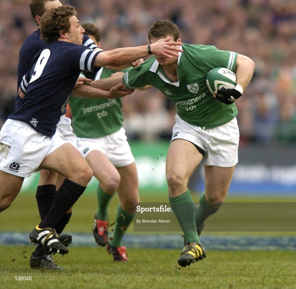 27 March 2004; Gordon D'Arcy, Ireland, in action against Chris Cusiter (9), Scotland. RBS Six Nations Rugby Championship 2003-2004, Ireland v Scotland, Lansdowne Road, Dublin. Picture credit; Brendan Moran / SPORTSFILE *EDI*