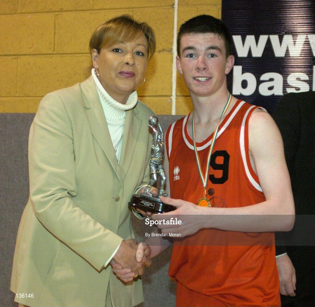 24 March 2004; Michael Chubb, St Fintan's, receives the MVP from Debbie Massey, Chief Executive, Basketball Ireland. All-Ireland Schoolboys Basketball League, U16 'A'  Final, St Joseph's, Galway v St Fintan's, Sutton, Dublin, ESB Arena, Tallaght, Dublin. Picture credit; Brendan Moran / SPORTSFILE *EDI*