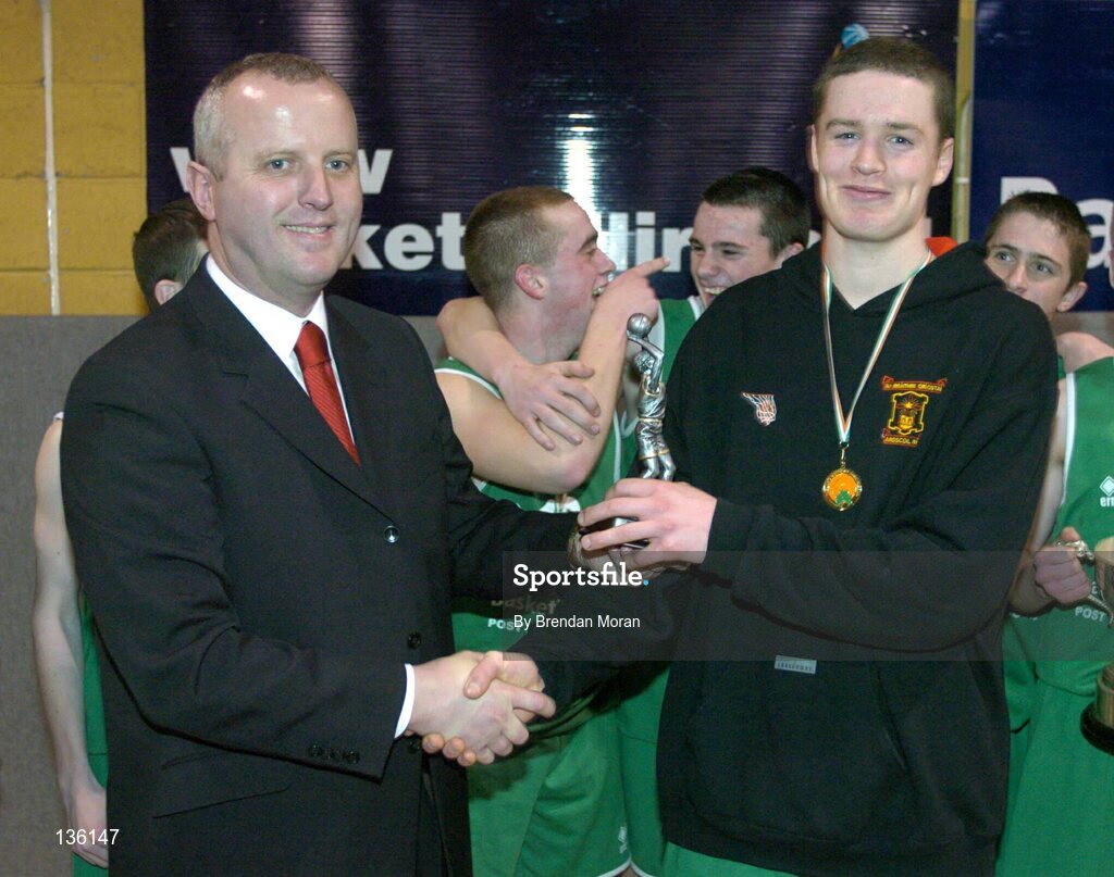 23 March 2004; Ben Honan, Ard Scoil Ris, is presented with the MVP by Martin Hehir, Schools Development Officer of Basketball Ireland. All-Ireland Schoolboys Basketball League, U16 'B'  Final, St Nathy's Co. Roscommon v Ard Scoil Ris, Limerick, ESB Arena, Tallaght, Dublin. Picture credit; Brendan Moran / SPORTSFILE *EDI*