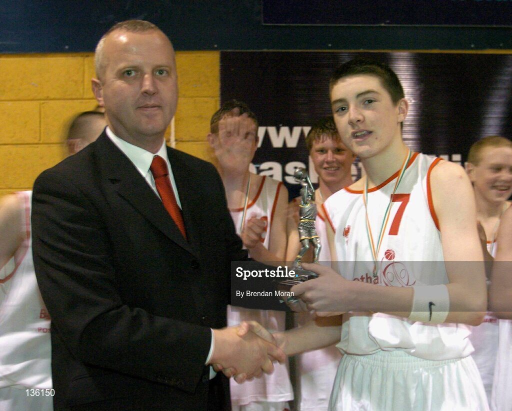 23 March 2004; Kevin Cahill, St Pat's, Shannon, receives the MVP from Martin Hehir, Schools Development Officer of Basketball Ireland. All-Ireland Schoolboys Basketball League, U16 'C'  Final, Dunshaughlin Community College, Meath v St Pat's, Shannon, Co. Clare, ESB Arena, Tallaght, Dublin. Picture credit; Brendan Moran / SPORTSFILE *EDI*