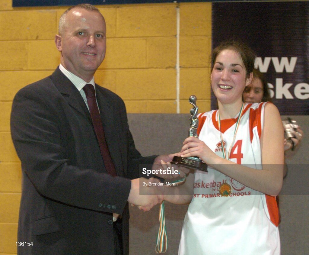 30 March 2004; Salesians' captain Rebecca Fitzgerlad receives the MVP from Martin Hehir, Schools Development Officer of Basketball Ireland. All - Ireland Schoolgirls Basketball League, Senior 'C' Final, Salesians, Limerick, v Killarney Community College, Kerry, ESB Arena, Tallaght, Dublin. Picture credit; Brendan Moran / SPORTSFILE *EDI*