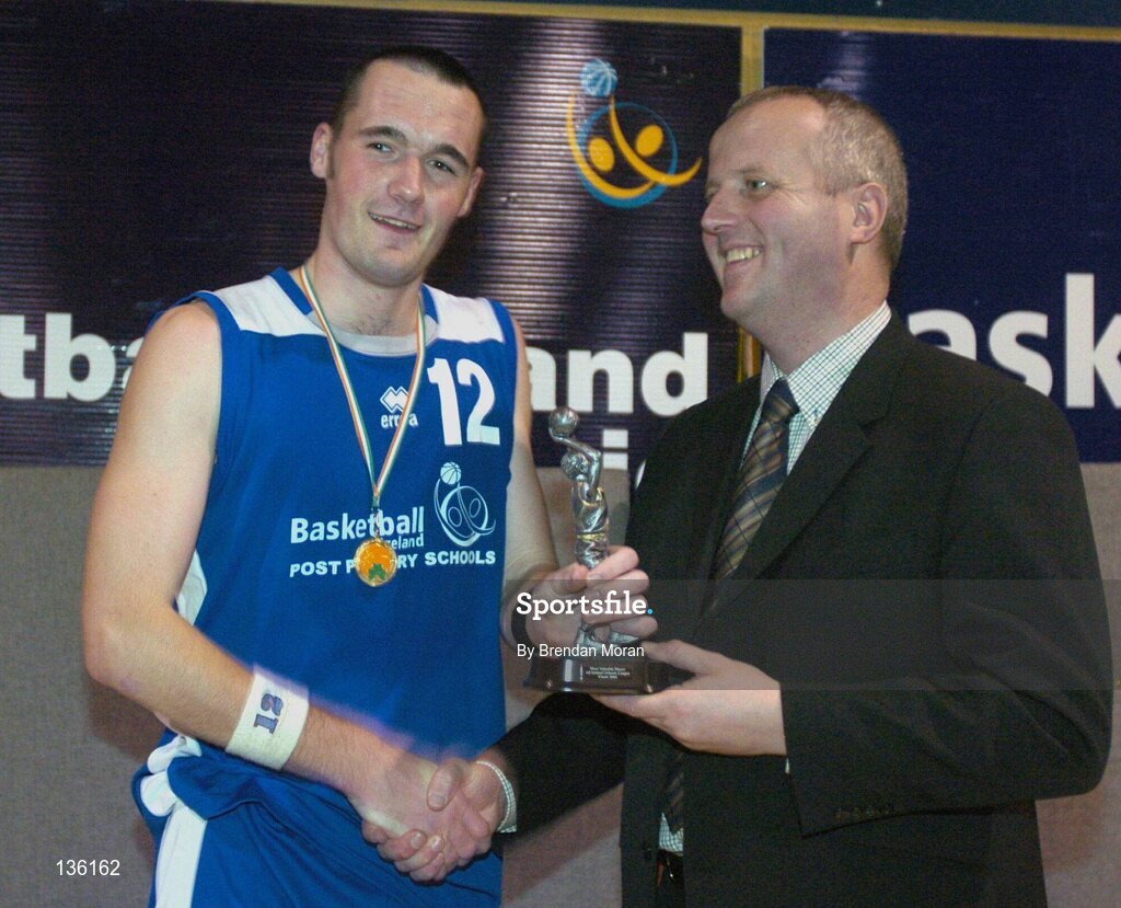 24 March 2004; John Dowling, Mercy Mounthawk, receives the MVP from Martin Hehir, Schools Development Officer of Basketball Ireland. All-Ireland Schoolboys Basketball League, U19 'B'  Final, Malahide Community School, Dublin v Mercy Mounthawk, Tralee, Co. Kerry, ESB Arena, Tallaght, Dublin. Picture credit; Brendan Moran / SPORTSFILE *EDI*