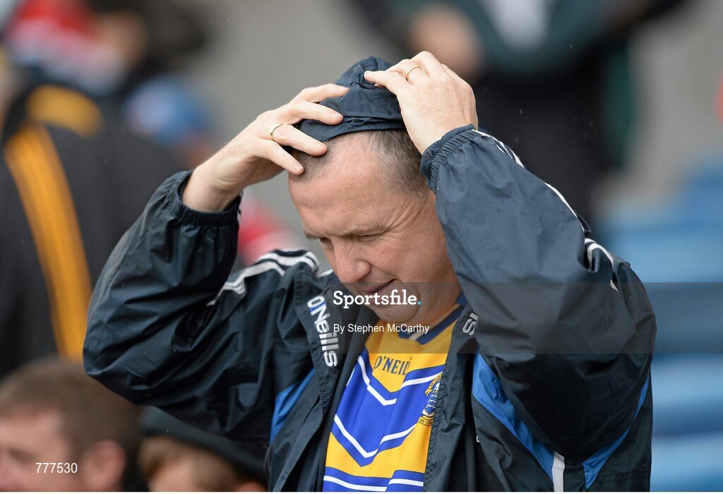 28 July 2013; A Clare supporter fixes his hood during a shower of rain. GAA Hurling All-Ireland Senior Championship, Quarter-Final, Galway v Clare, Semple Stadium, Thurles, Co. Tipperary. Picture credit: Stephen McCarthy / SPORTSFILE